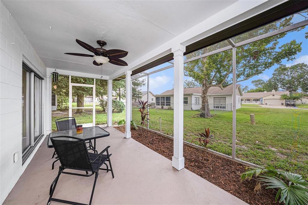 13013 Sawmill Way Hudson, FL 34667 - Photo 21 of 33 a view of a porch with furniture and a yard