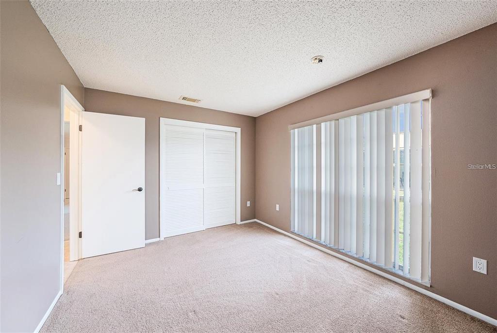 13013 Sawmill Way Hudson, FL 34667 - Photo 24 of 33 a view of an empty room with a window