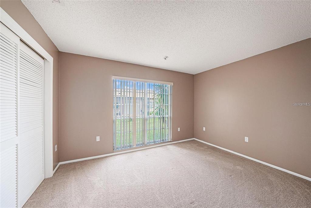 13013 Sawmill Way Hudson, FL 34667 - Photo 25 of 33 an empty room with windows