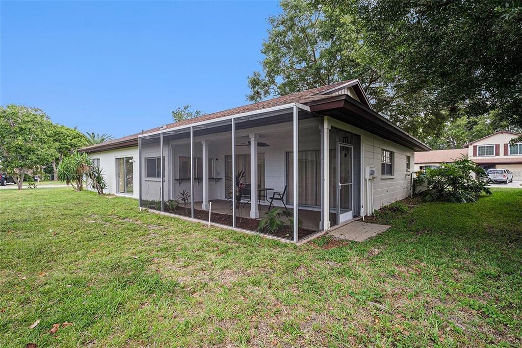 13013 Sawmill Way Hudson, FL 34667 - Photo 29 of 33 a view of a house with a yard and large tree