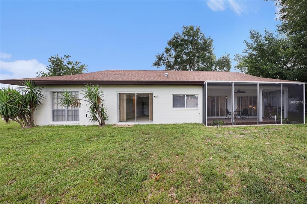 13013 Sawmill Way Hudson, FL 34667 - Photo 30 of 33 a front view of a house with a garden