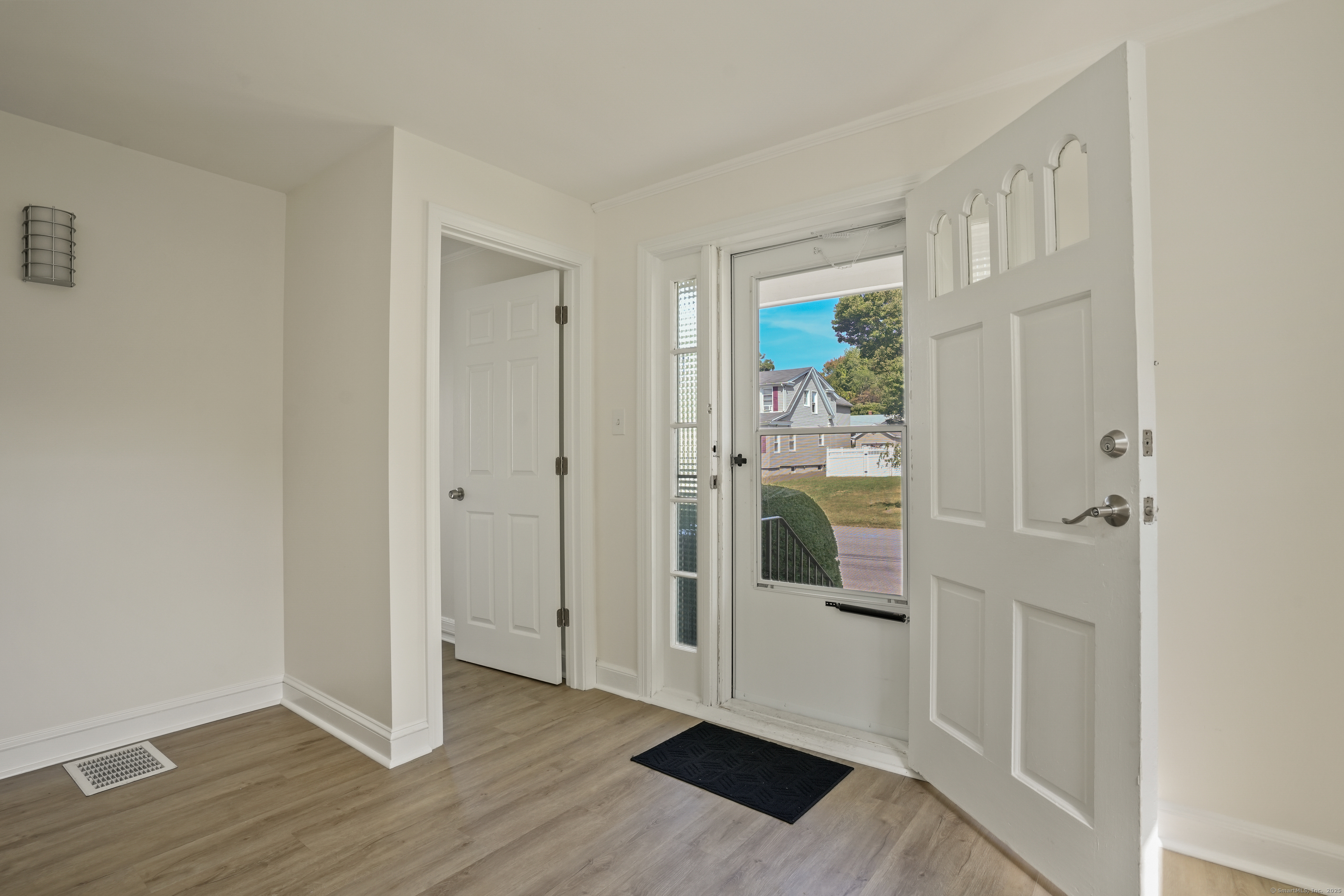 221 Hunyadi Avenue Fairfield, CT 06824 - Photo 3 of 39 a view of entryway with wooden floor
