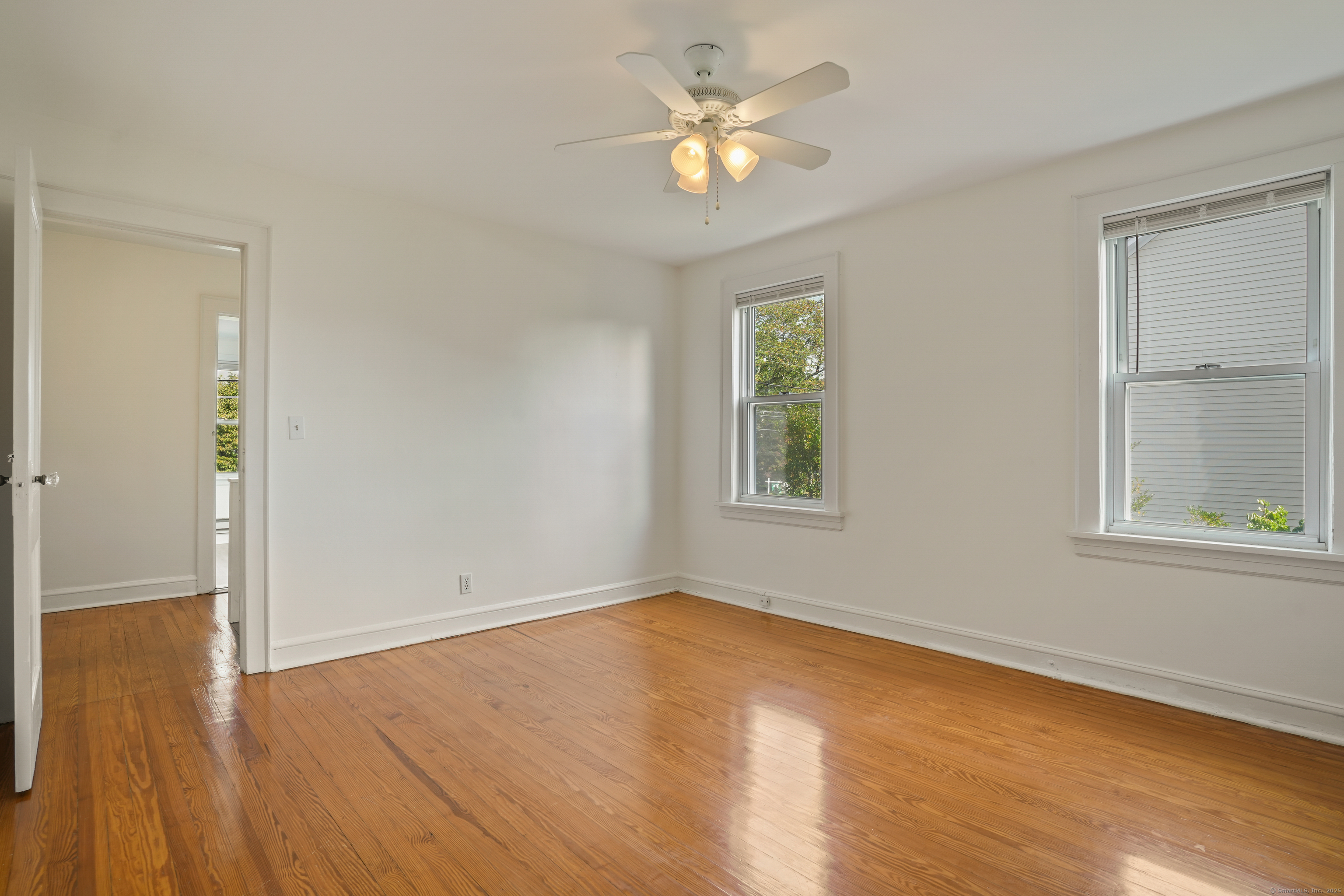 221 Hunyadi Avenue Fairfield, CT 06824 - Photo 32 of 39 wooden floor in an empty room with a window