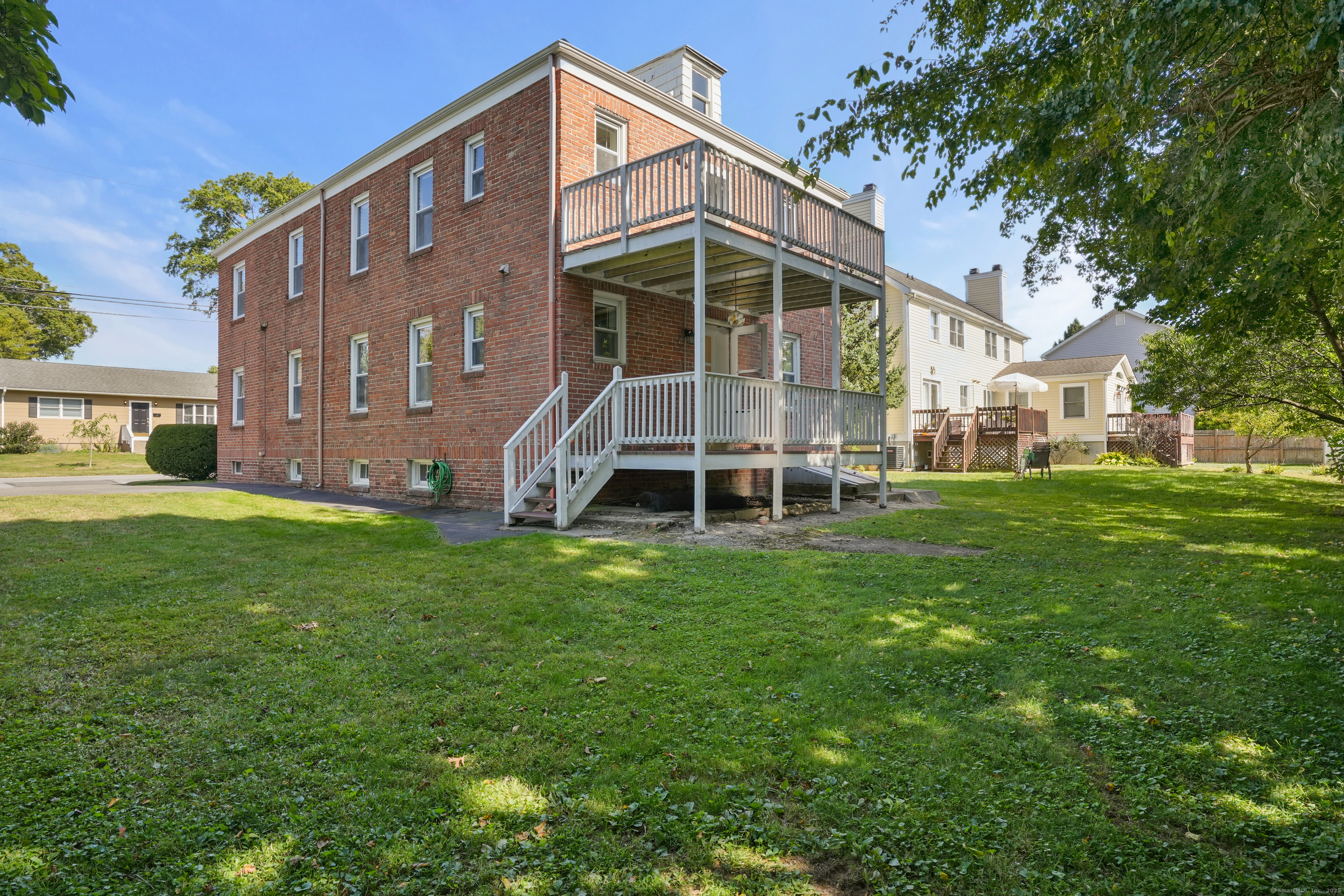 221 Hunyadi Avenue Fairfield, CT 06824 - Photo 37 of 39 a view of house with a yard