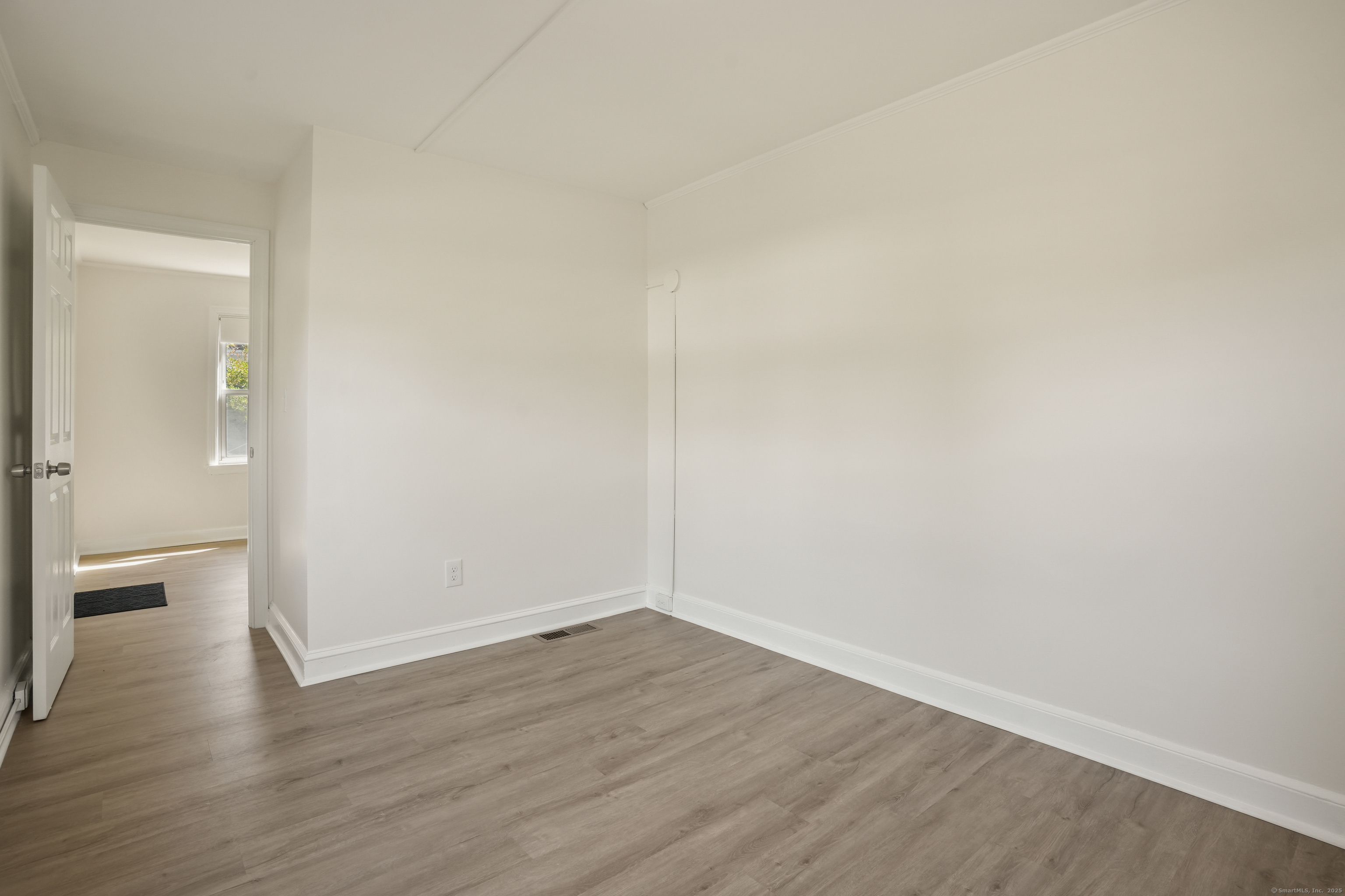 221 Hunyadi Avenue Fairfield, CT 06824 - Photo 4 of 39 a view of a room with wooden floor