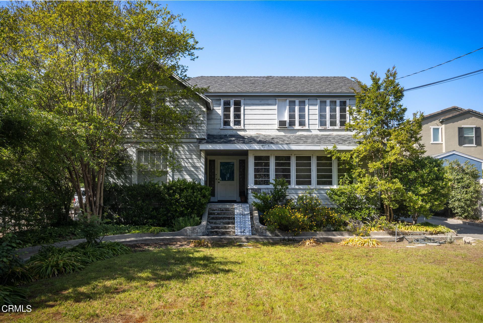 1055 Locust Street Pasadena, CA 91106 - Photo 2 of 14 a front view of house with yard and green space