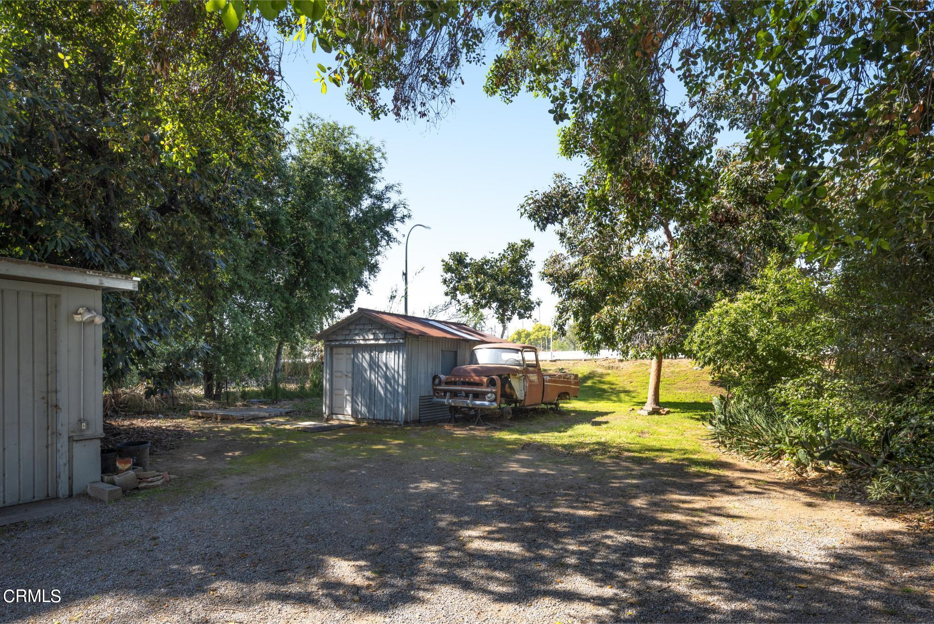 1055 Locust Street Pasadena, CA 91106 - Photo 6 of 14 a view of a house with large trees