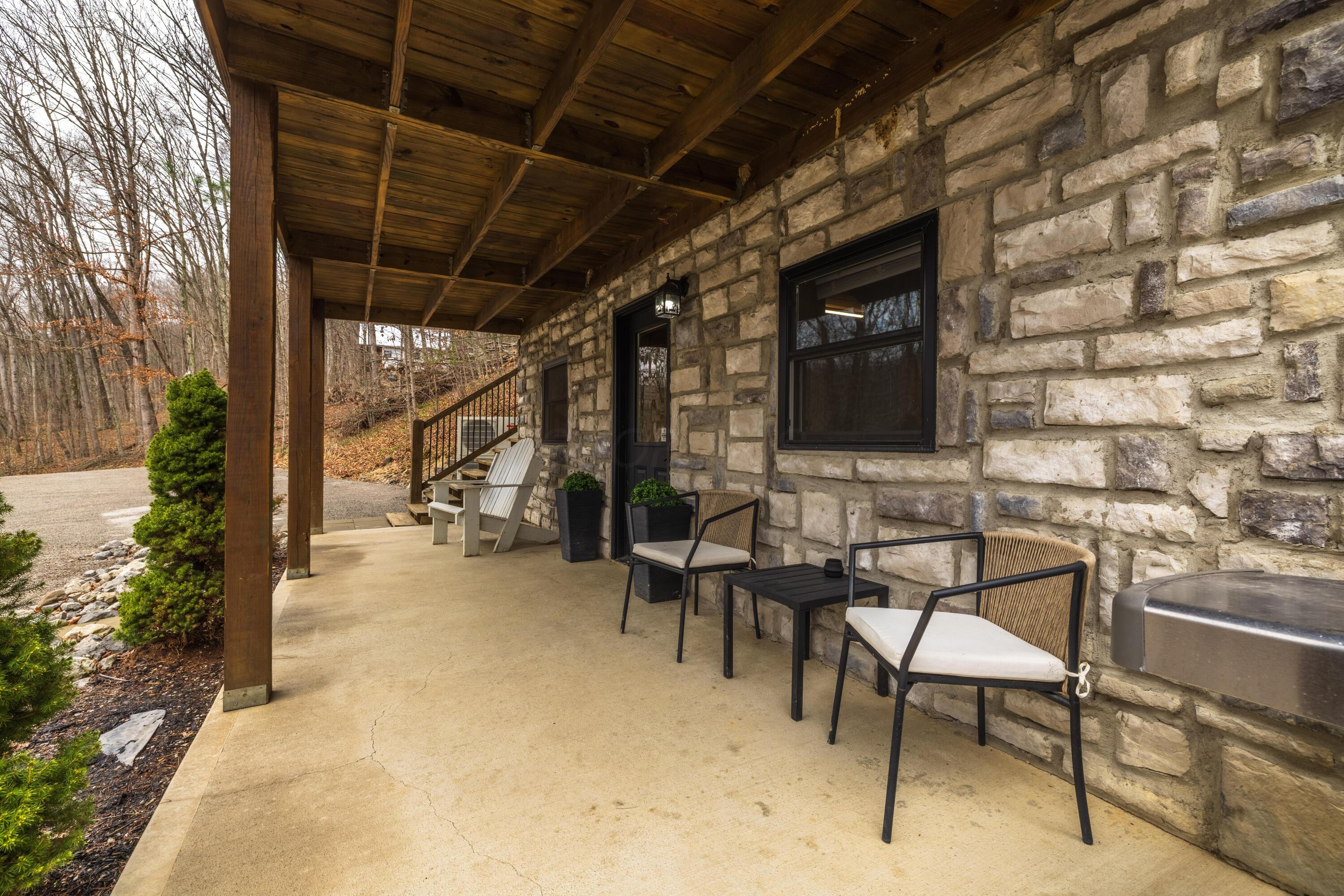 344 Skaggs Road Londonderry, OH 45647 - Photo 47 of 57 Sage Hill Cabin lower patio accessing outdoor entertainment