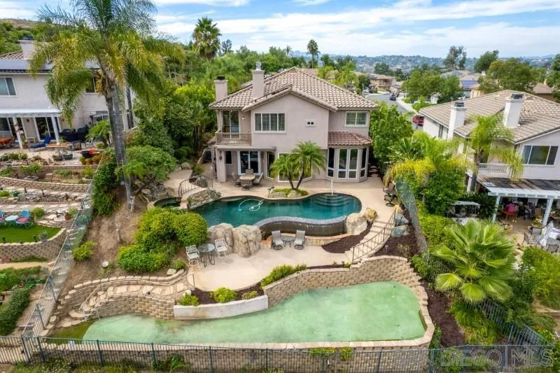 3674 Via Calabria Escondido, CA 92025 - Photo 1 of 49 a front view of a house with a garden
