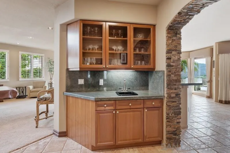 3674 Via Calabria Escondido, CA 92025 - Photo 12 of 49 a kitchen with a sink and cabinets