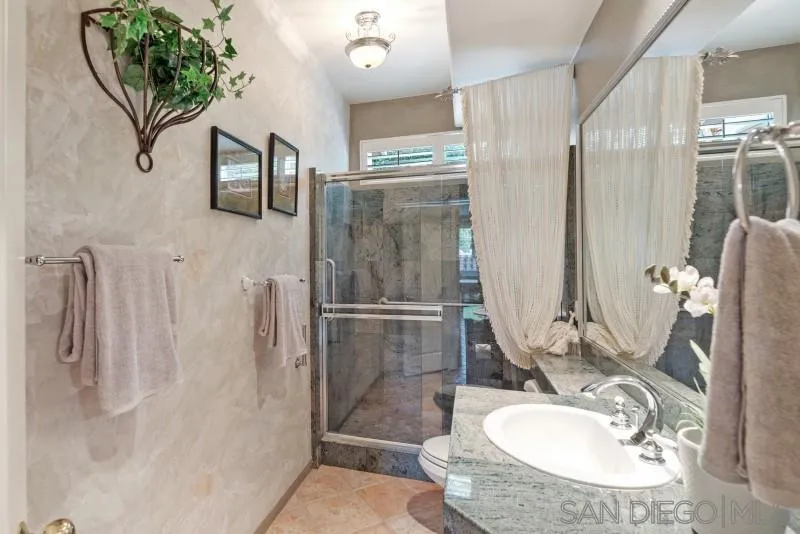 3674 Via Calabria Escondido, CA 92025 - Photo 21 of 49 a bathroom with a sink toilet and shower