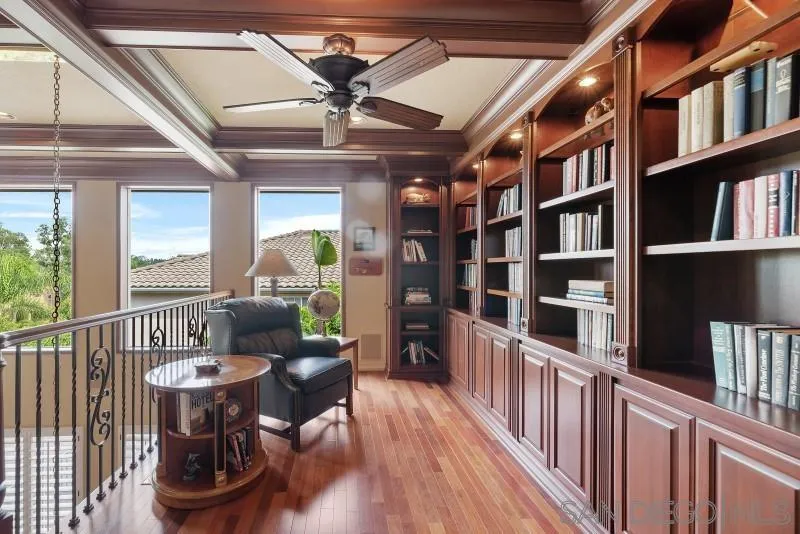 3674 Via Calabria Escondido, CA 92025 - Photo 23 of 49 a living room with furniture and a book shelf