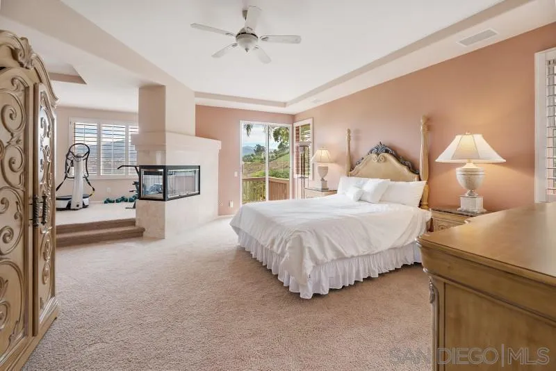 3674 Via Calabria Escondido, CA 92025 - Photo 25 of 49 a spacious bedroom with a bed and a lamp