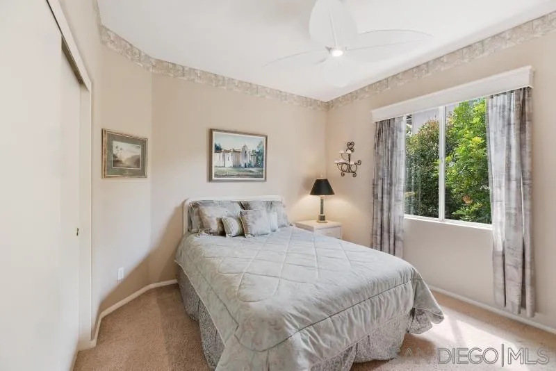 3674 Via Calabria Escondido, CA 92025 - Photo 31 of 49 a bedroom with a bed and a large window