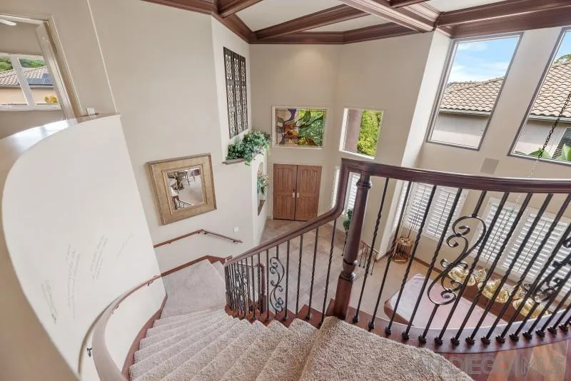 3674 Via Calabria Escondido, CA 92025 - Photo 36 of 49 a view of staircase with lots of frames on wall and a large window