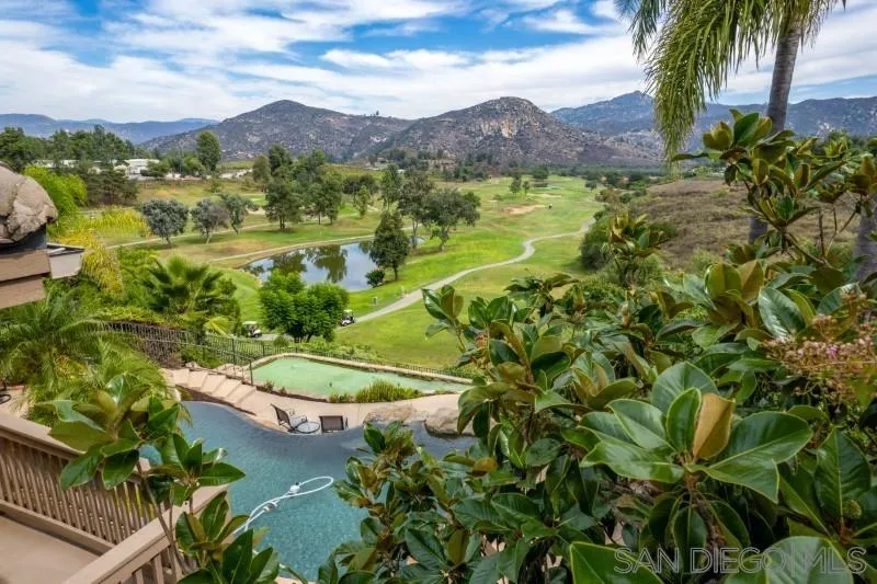 3674 Via Calabria Escondido, CA 92025 - Photo 37 of 49 a view of a lake with a mountain in the background