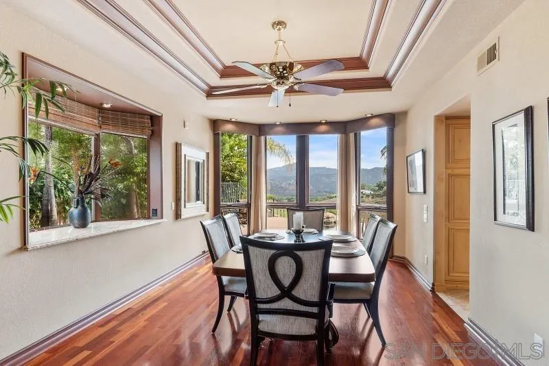 3674 Via Calabria Escondido, CA 92025 - Photo 10 of 49 a view of a dining room with furniture window and wooden floor