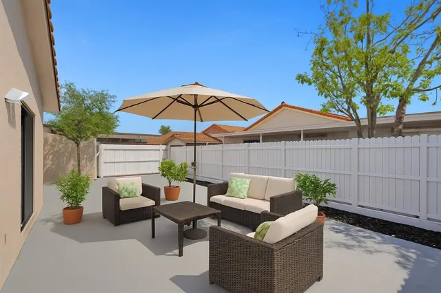 a view of a terrace with couches and a potted plant