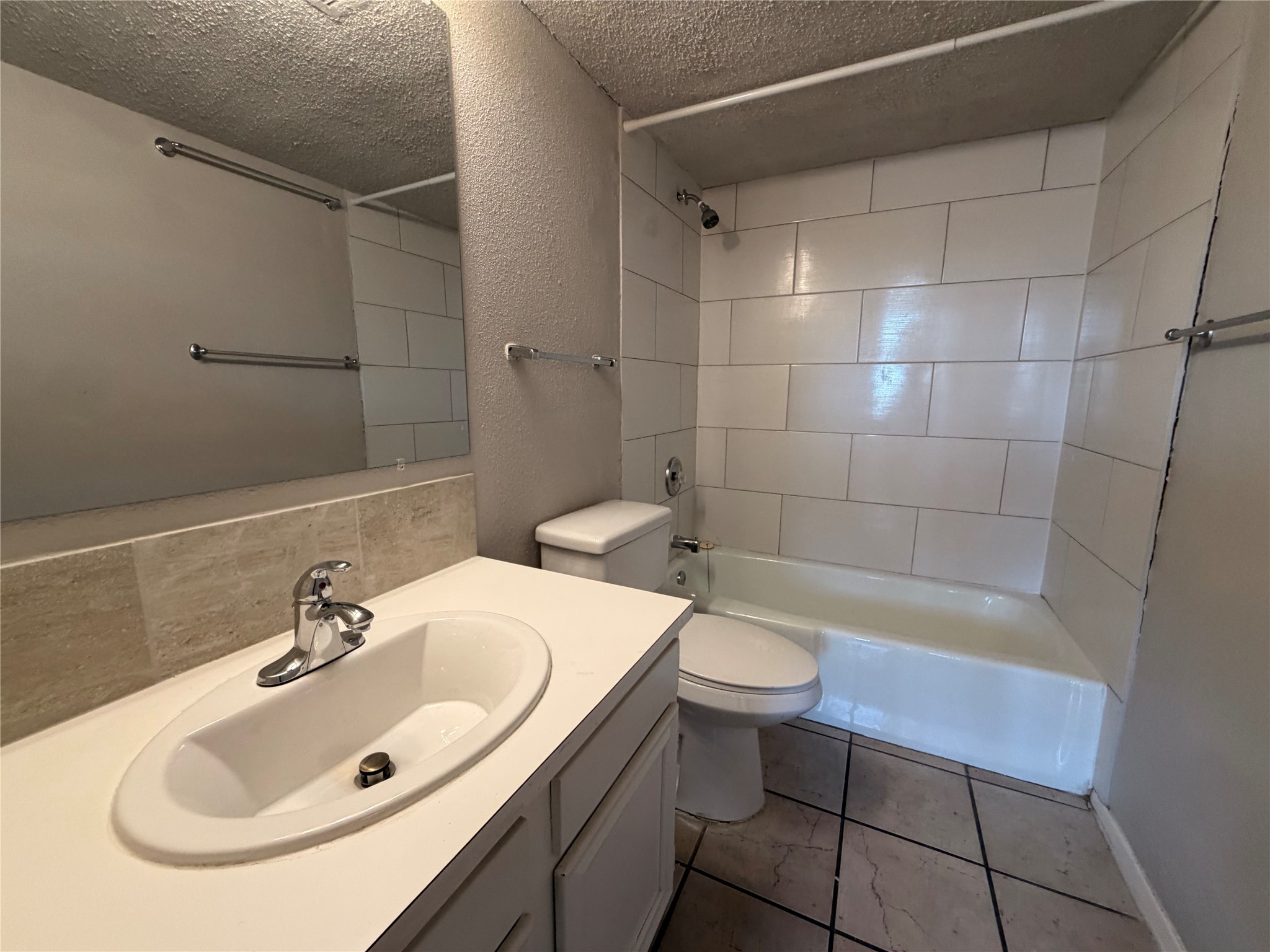 4303 Duval Street, Unit 204 Austin, TX 78751 - Photo 12 of 14 a bathroom with a sink a toilet and bathtub
