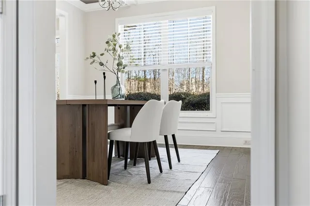 a kitchen with kitchen island granite countertop wooden cabinets stainless steel appliances and a center island
