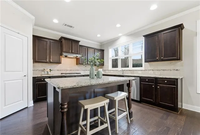 an empty room with a window and a ceiling fan