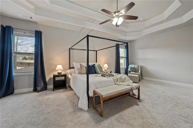 a large spacious bathroom with a large tub shower and sink