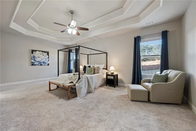 a spacious bathroom with a granite countertop sink and a mirror
