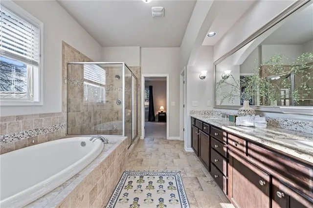 a white toilet sitting next to a bath tub