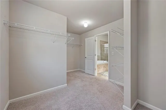 a view of a hallway view with staircase