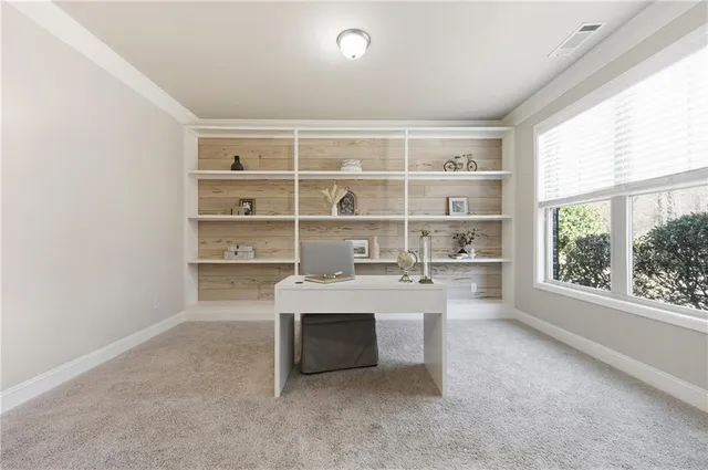 a living room with furniture a fireplace and a ceiling fan