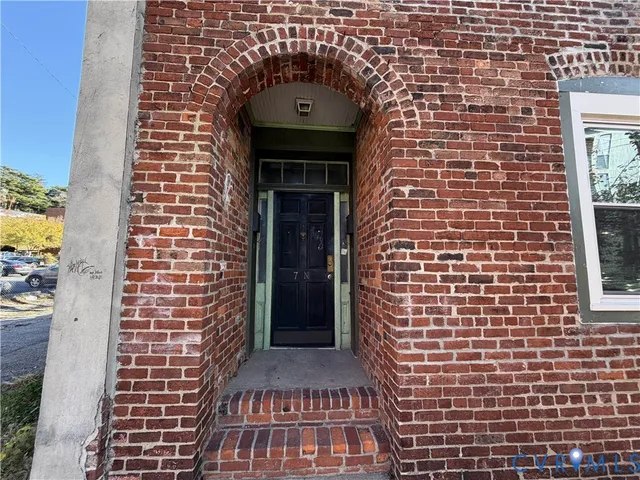 a brick building with a door