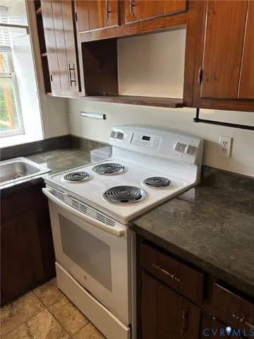 a kitchen with a stove and a microwave