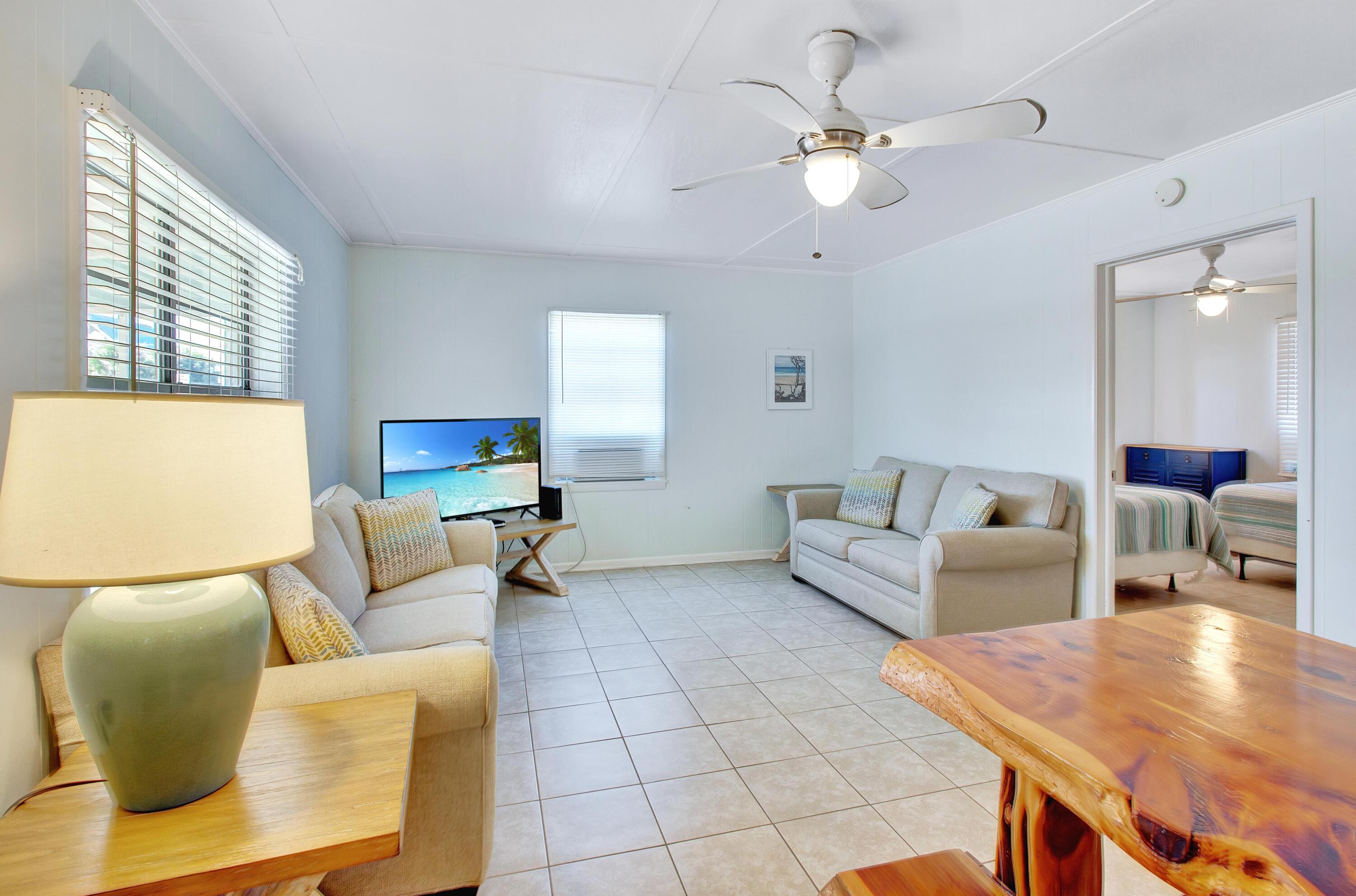 545 Blue Mountain Road Santa Rosa Beach, FL 32459 - Photo 4 of 27 a living room with furniture and a large window