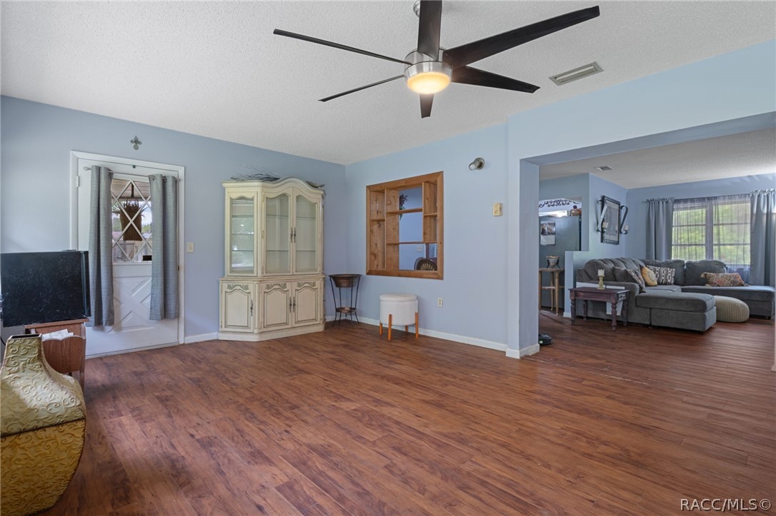 3355 South Highlands Avenue Inverness, FL 34452 - Photo 17 of 30 a view of a livingroom with furniture and a ceiling fan