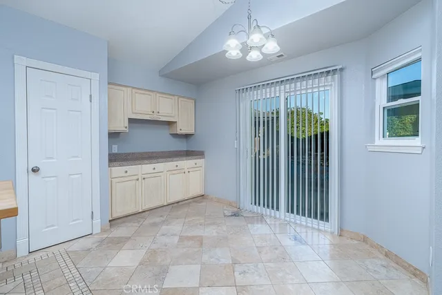a view of a kitchen with a sink and dishwasher cabinets