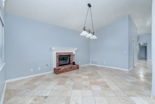 a view of a room with fan and table
