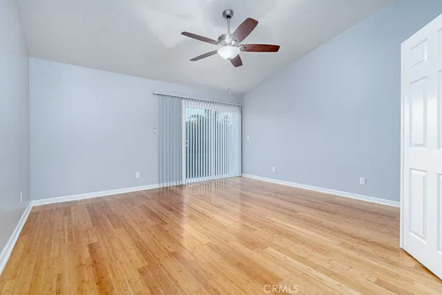 a view of an empty room and wooden floor