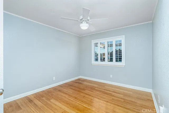 wooden floor in a room next to a window