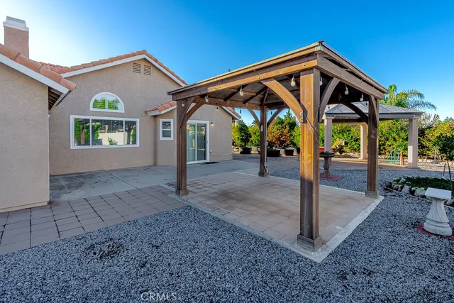 a front view of house with a garden