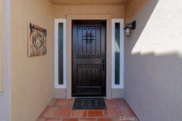 a view of a closet area with wooden floor