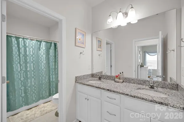 a view of a bedroom with cabinet cabinet cabinet and front door