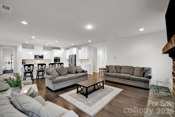 a view of kitchen with sink and living room