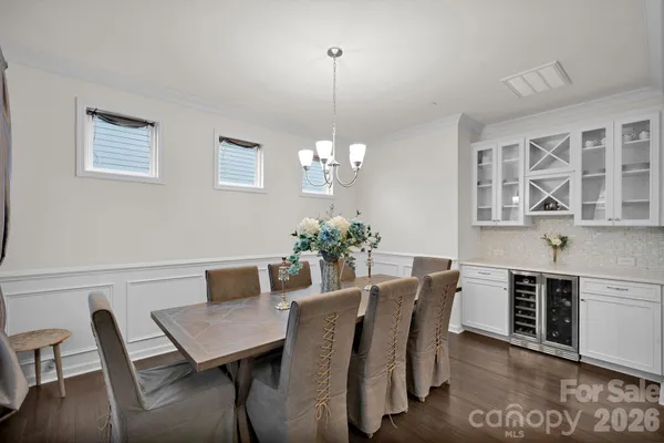 a large kitchen with a table and chairs
