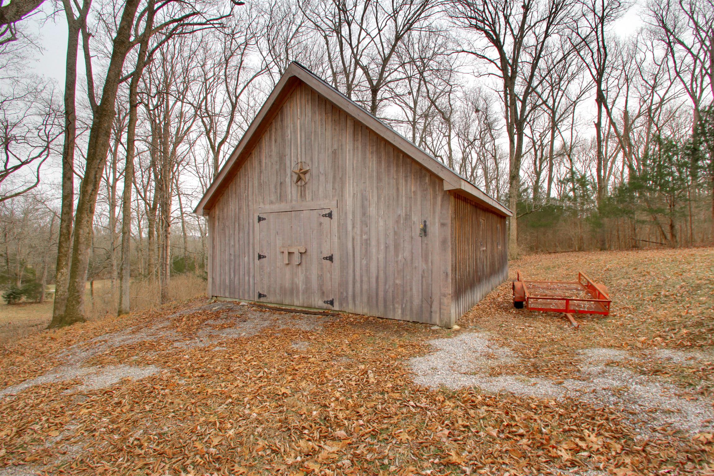 788 High Point Ridge Road Franklin, TN 37069 - Photo 11 of 30 a backyard of a house with trees and barbeque oven
