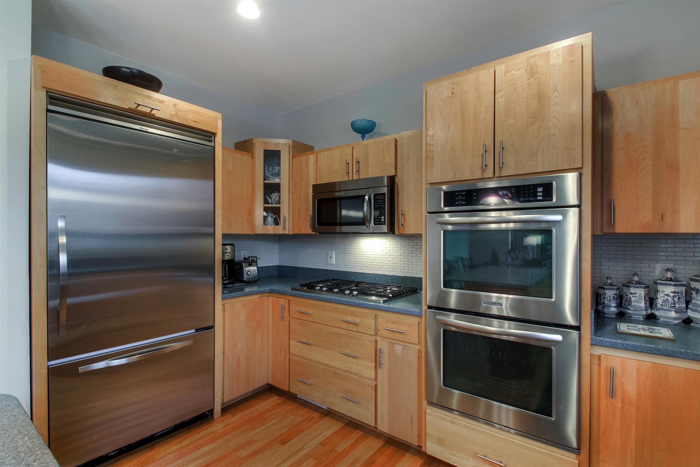 788 High Point Ridge Road Franklin, TN 37069 - Photo 21 of 30 a kitchen with granite countertop stainless steel appliances and wooden cabinets
