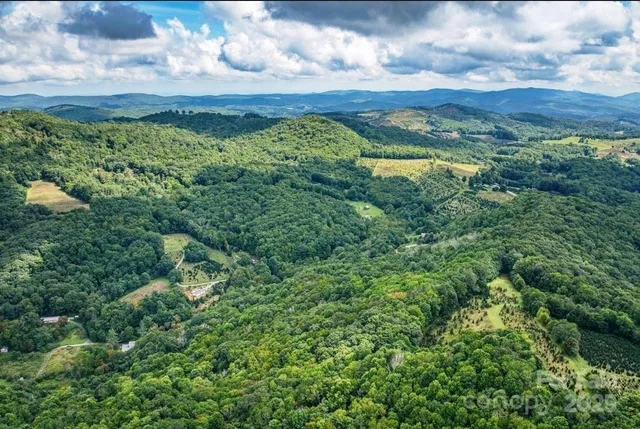 a view of lake with mountain in the background