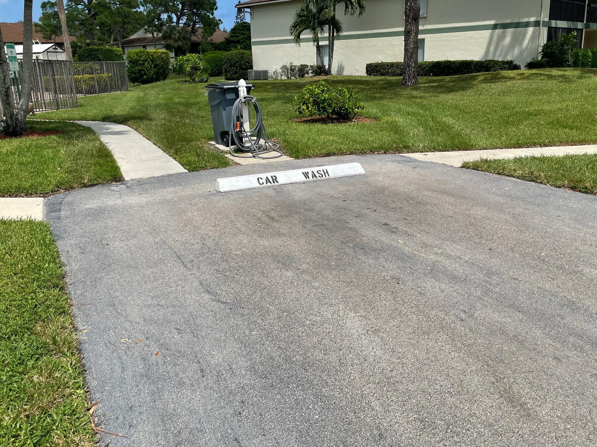 6485 Chasewood Drive, Unit C Jupiter, FL 33458 - Photo 19 of 23 a park view with a garden