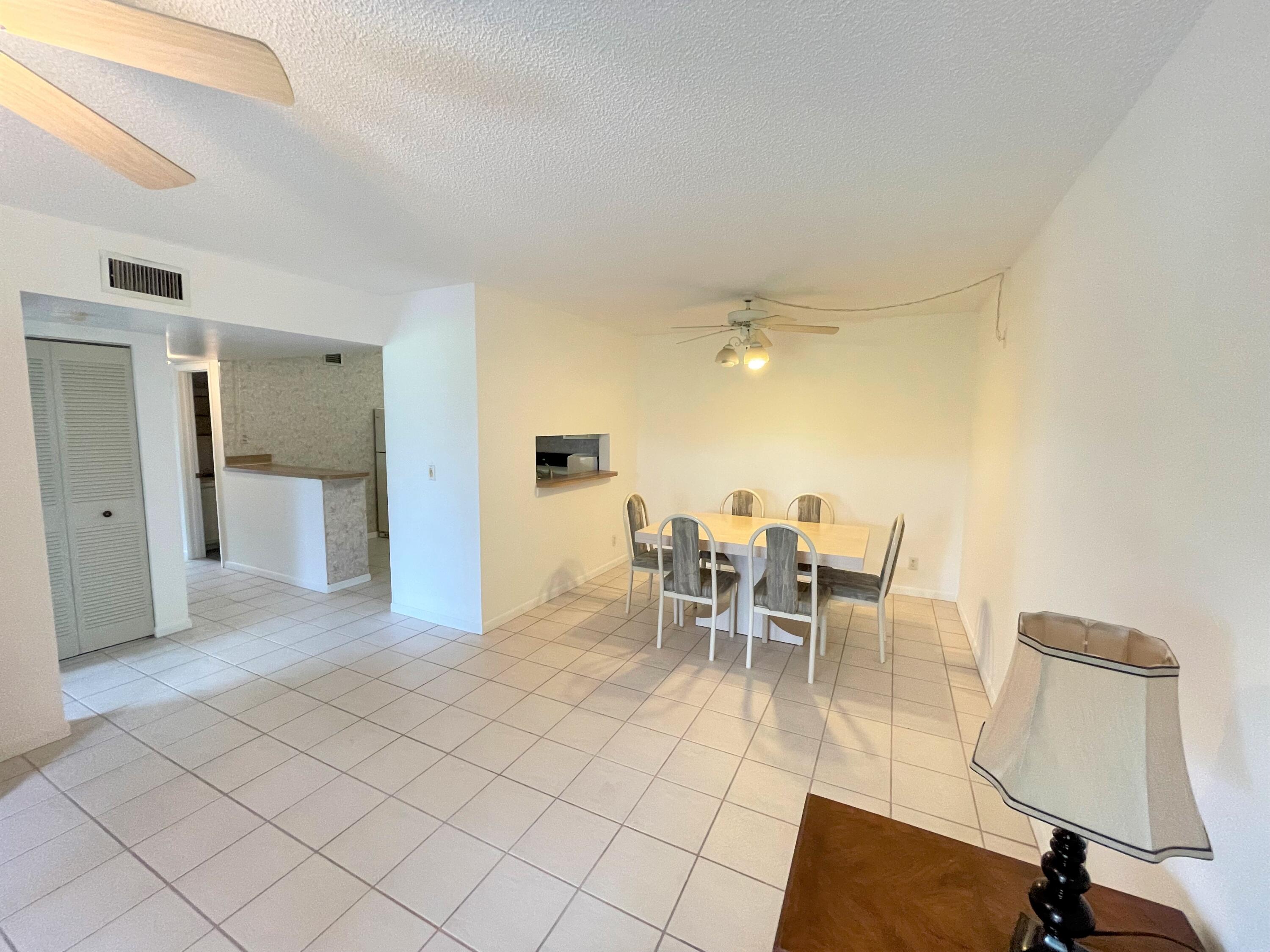 6485 Chasewood Drive, Unit C Jupiter, FL 33458 - Photo 5 of 23 a dining room well furnished