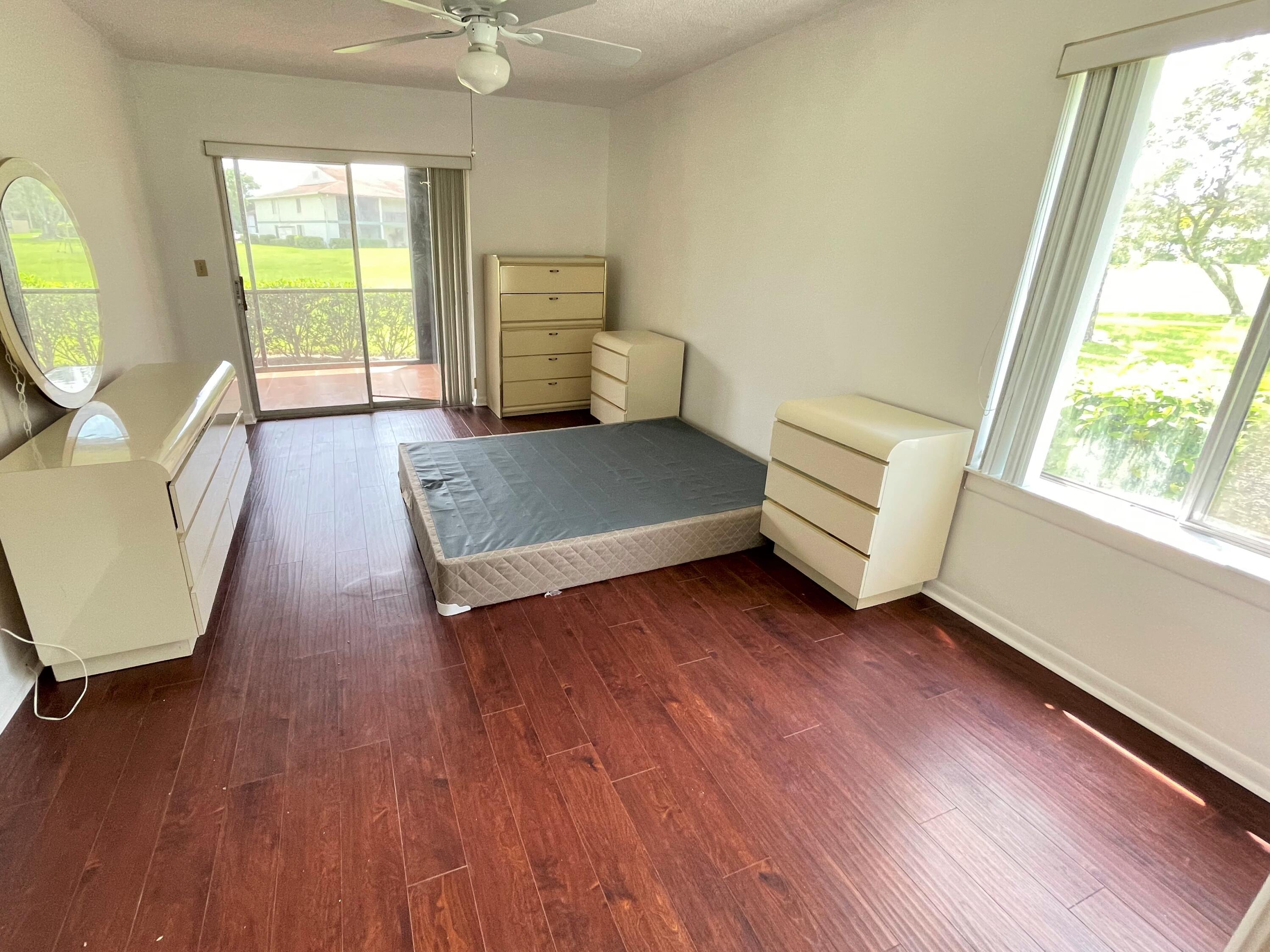6485 Chasewood Drive, Unit C Jupiter, FL 33458 - Photo 10 of 23 a living room with furniture and a window