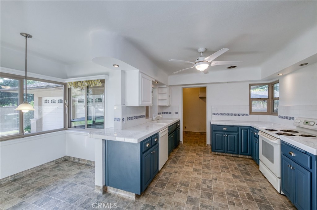 610 Park Madera, CA 93637 - Photo 13 of 35 a kitchen with stainless steel appliances granite countertop a stove and a sink
